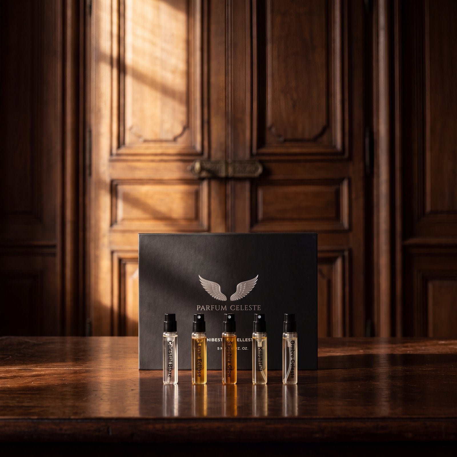 The Parfum Celeste Discovery Set box and its five extrait de parfum minis in a beam of warm light in a dark wood-panelled room