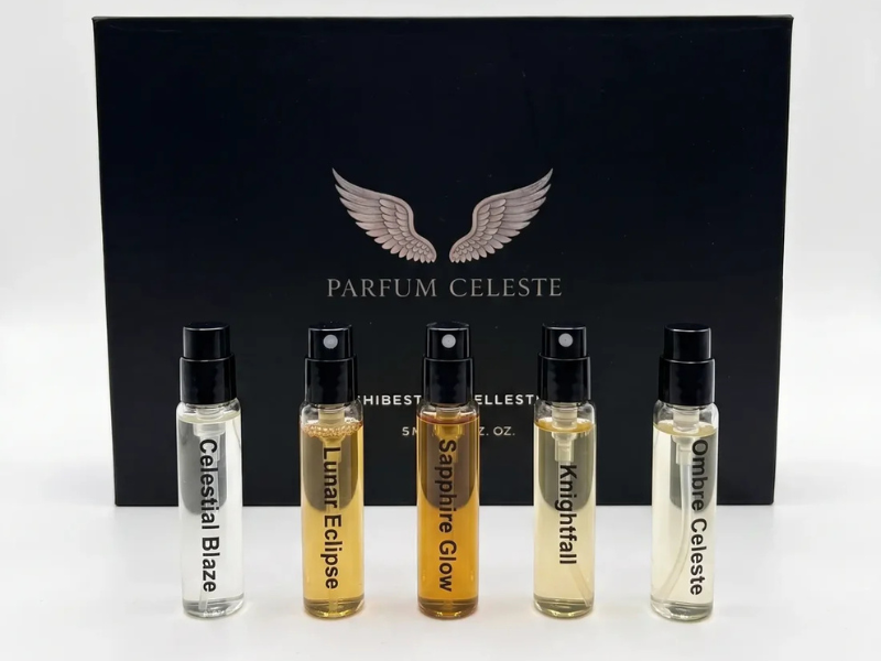 Parfum Celeste Discovery Set: five extrait de parfum minis, Celestial Blaze, Lunar Eclipse, Saphire Glow, Knightfall and Ombre Celeste, in front of the black winged gift box